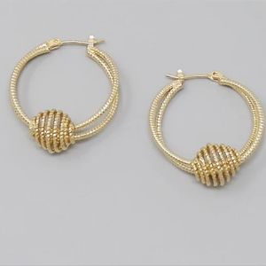 Gold tone 80s style hoops with twisted features